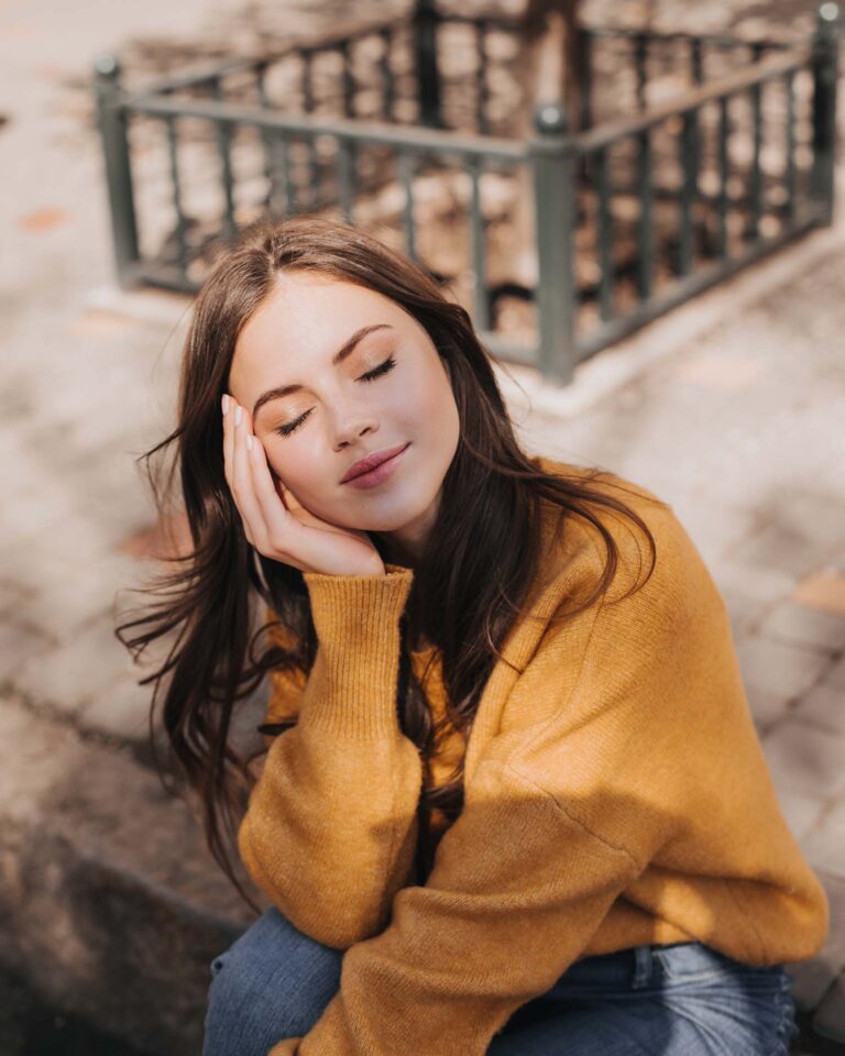 adorable-girl-in-beautiful-sweater-leaned-and-sitt-ZC6FRKQ